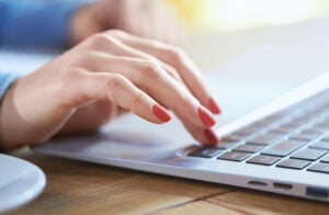 hand on computer keyboard