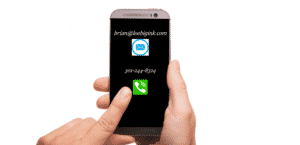 Hand pressing call button on cell phone